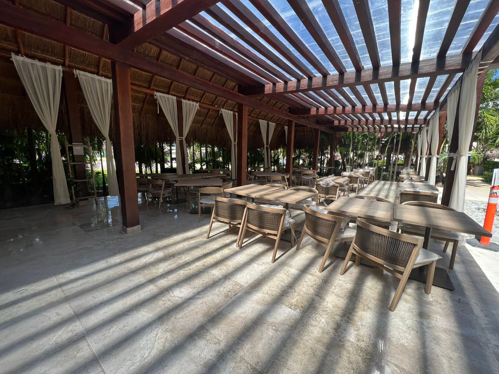 Olio outdoor dining area — natural timber pergola structure and lattice ceiling, Paradisus Playa del Carmen