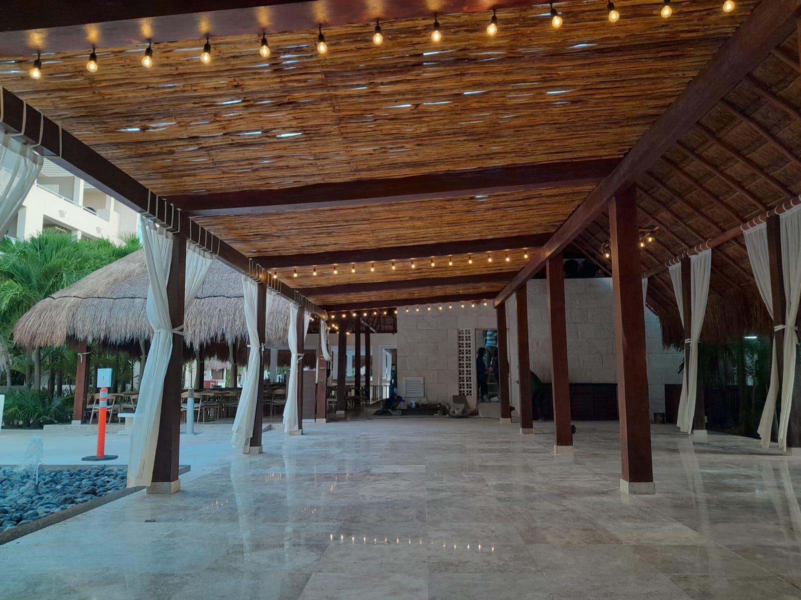 Olio finished space — evening atmosphere through natural wood lattice and custom millwork